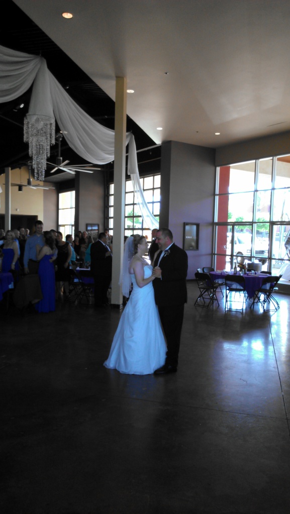 bride and groom first dance at crossroads church in corona 