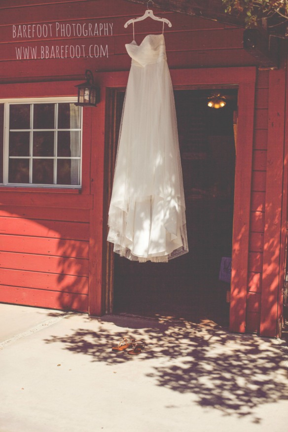 wedding dress hanging at farm house at whispering oaks terrace 